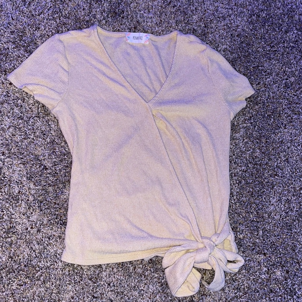 yellow shirt, ties at the bottom